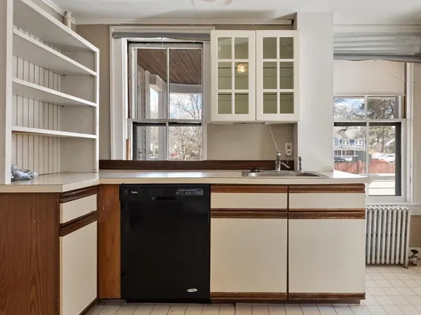 a kitchen with a sink and a window