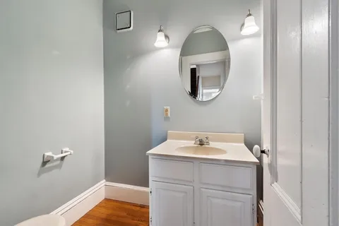 a bathroom with a sink and mirror