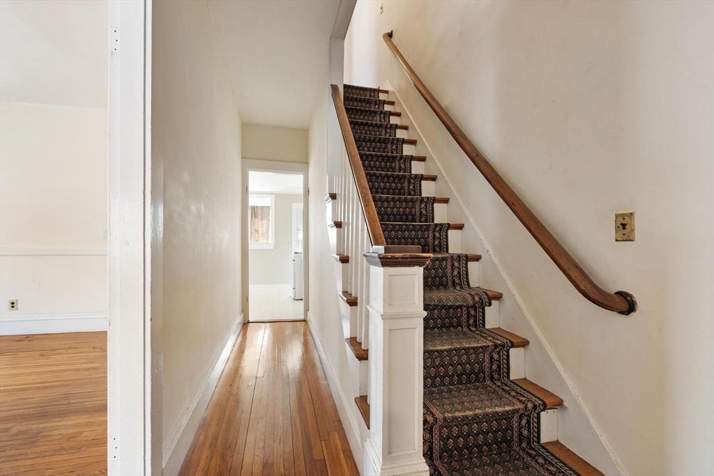 95 Hubbard Street, Unit 95 Concord, MA 01742 - Photo 9 of 22 a view of entryway with wooden floor