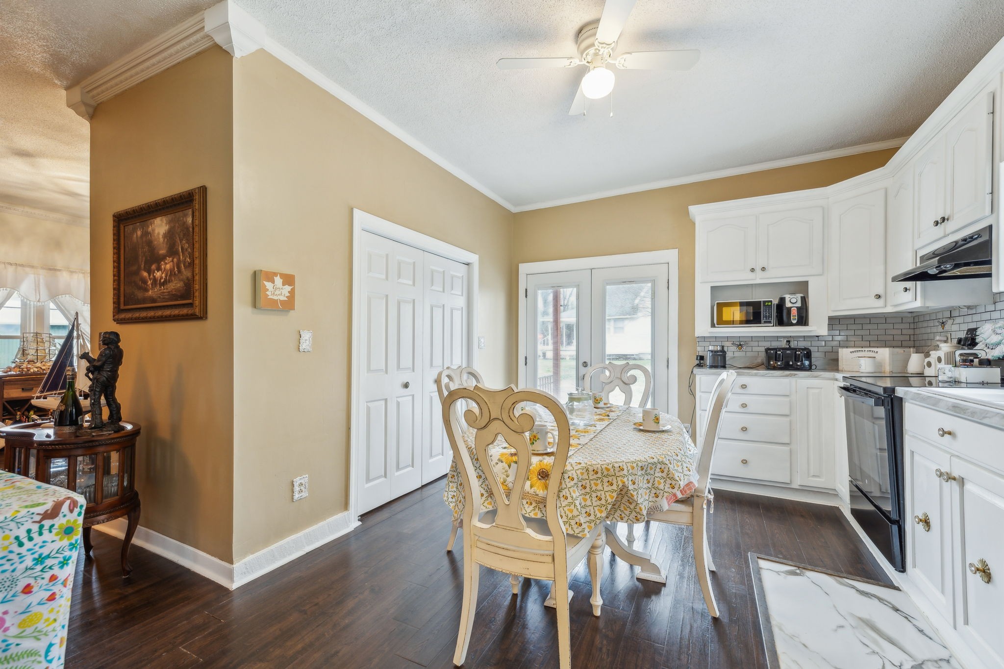 479 Elora Road Elora, TN 37328 - Photo 16 of 57 a kitchen with white cabinets and stainless steel appliances