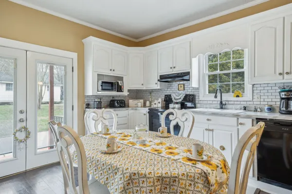 a kitchen with a stove and a sink