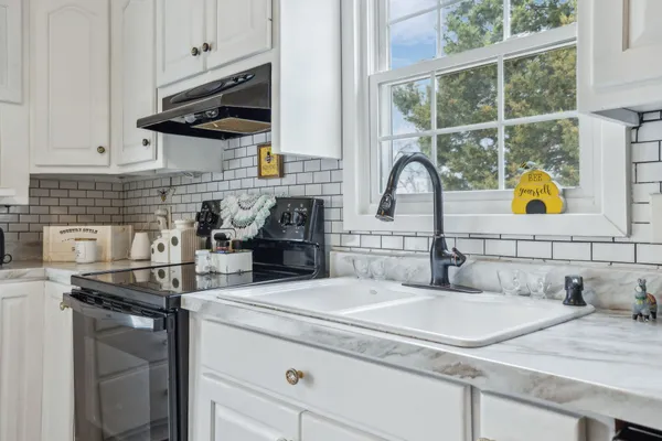 a view of dining room and kitchen with furniture