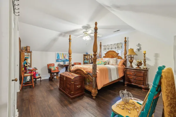 a bedroom with bed and a window