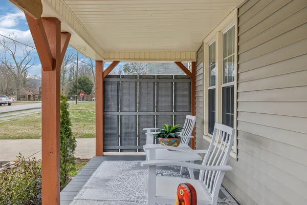 a view of entryway door with wooden floor