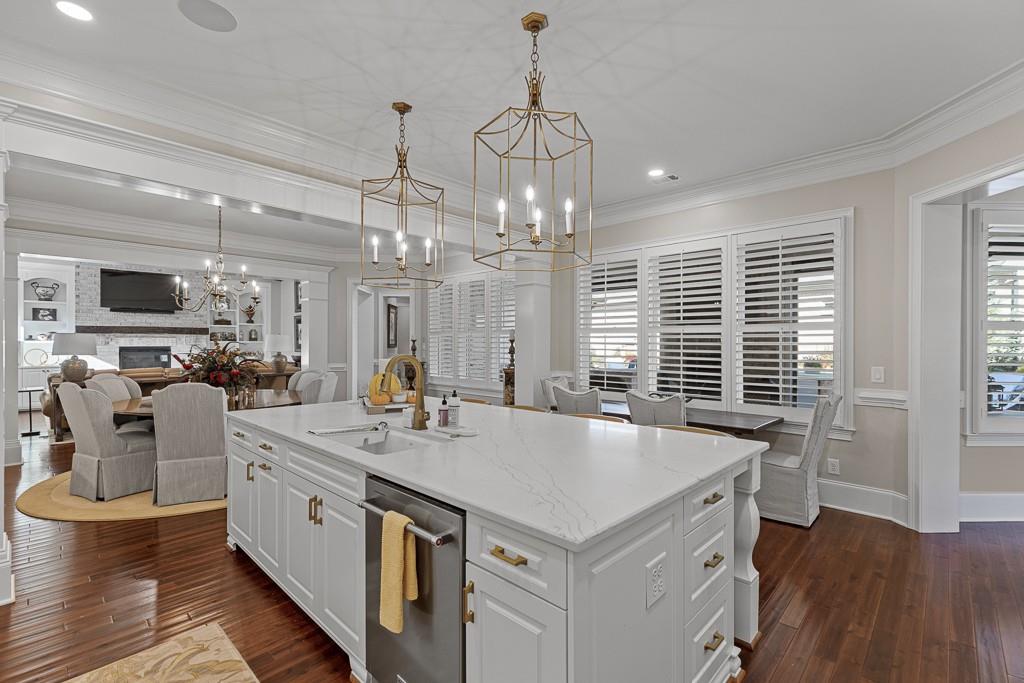 2794 Cork Street Hoschton, GA 30548 - Photo 14 of 51 a kitchen that has a lot of white furniture and wooden floor