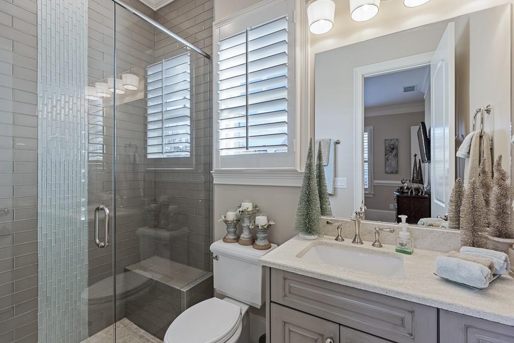 2794 Cork Street Hoschton, GA 30548 - Photo 32 of 51 a bathroom with a sink toilet and shower