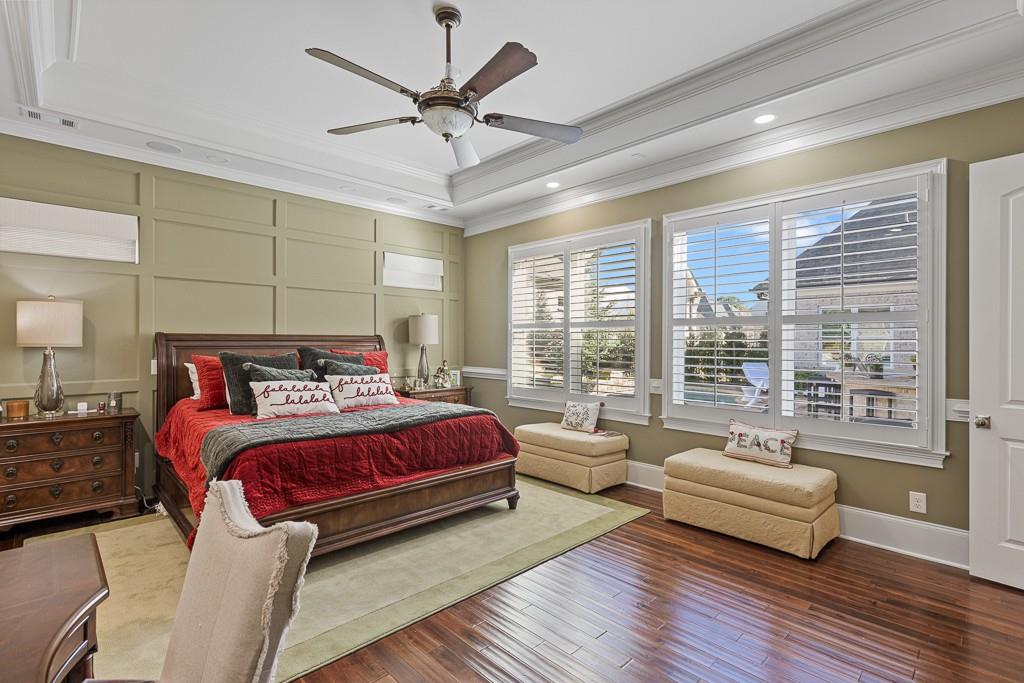 2794 Cork Street Hoschton, GA 30548 - Photo 34 of 51 a spacious bedroom with a bed couch and a large window