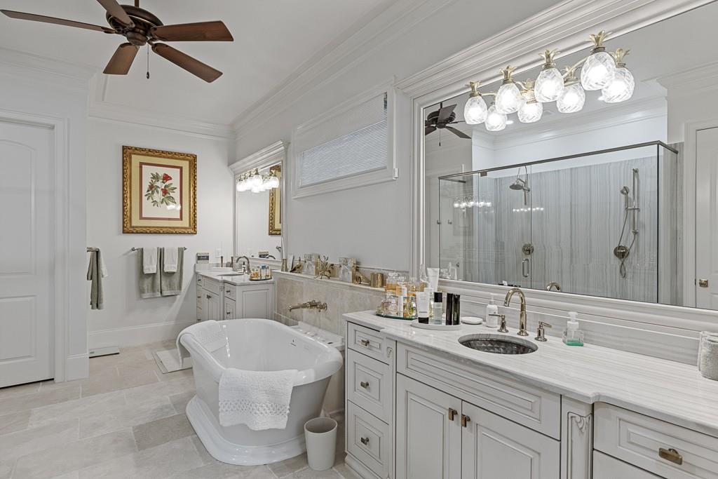 2794 Cork Street Hoschton, GA 30548 - Photo 36 of 51 a bathroom with a double vanity sink mirror and bathtub