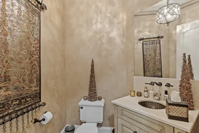 a living room with furniture a window and a clock