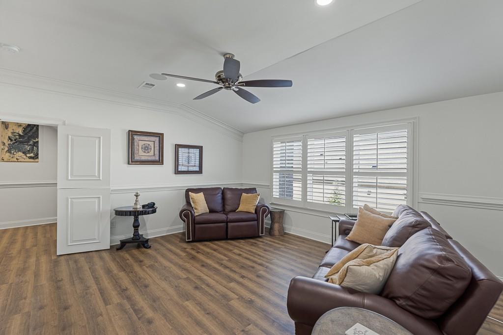 2794 Cork Street Hoschton, GA 30548 - Photo 42 of 51 a living room with furniture and a window