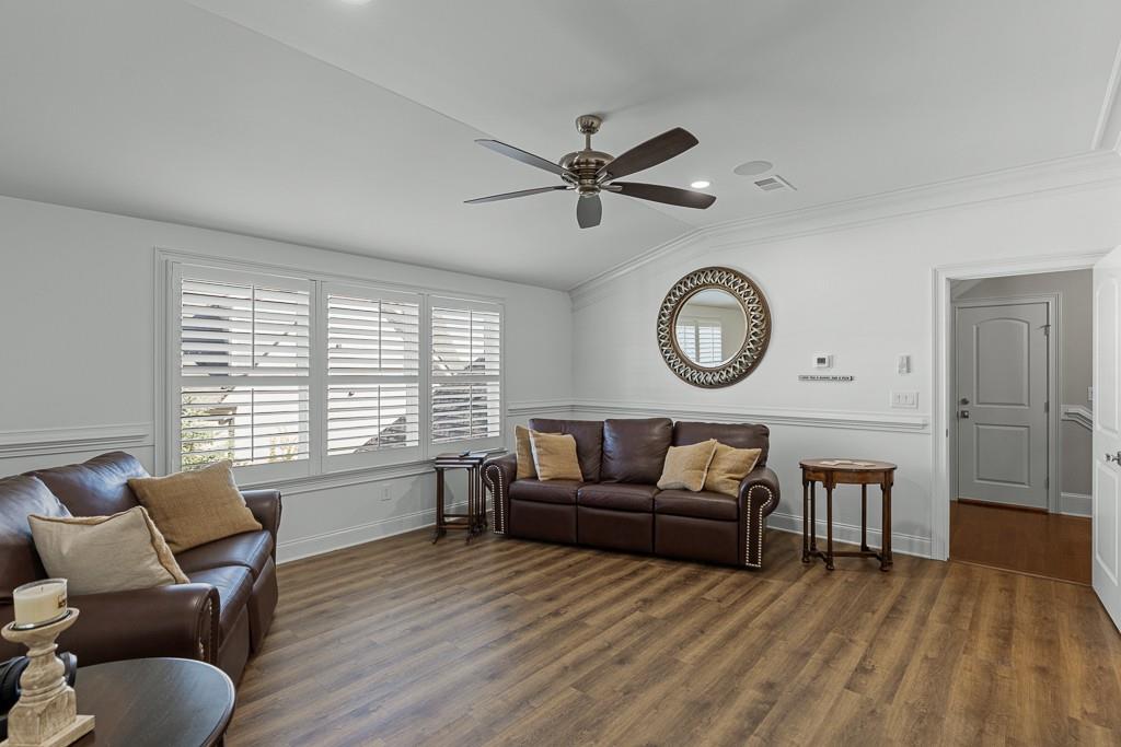 2794 Cork Street Hoschton, GA 30548 - Photo 43 of 51 a living room with furniture a window and a clock