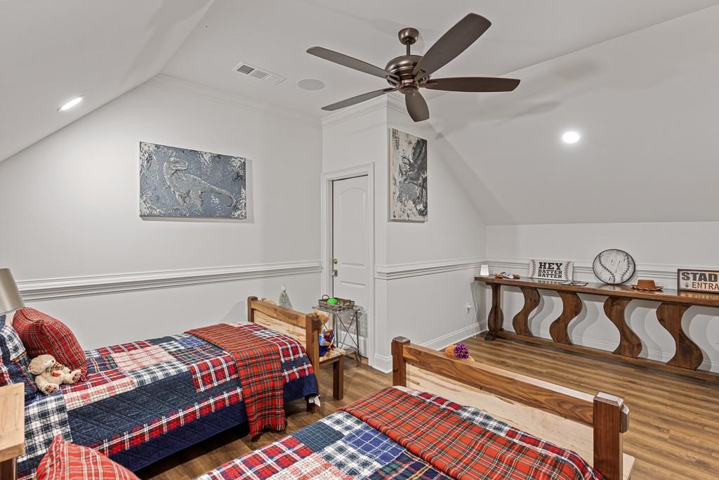 2794 Cork Street Hoschton, GA 30548 - Photo 47 of 51 a bedroom with a bed and a dresser