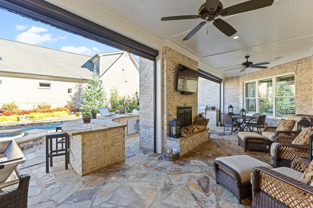 2794 Cork Street Hoschton, GA 30548 - Photo 48 of 51 a living room with furniture and a large window