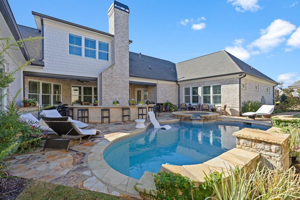 2794 Cork Street Hoschton, GA 30548 - Photo 5 of 51 a view of a house with swimming pool and sitting area
