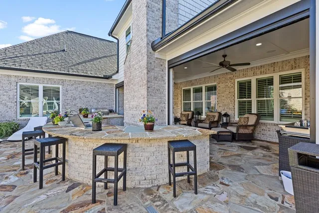 a large kitchen with a table and chairs