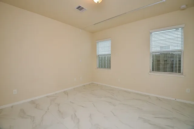 an empty room with windows