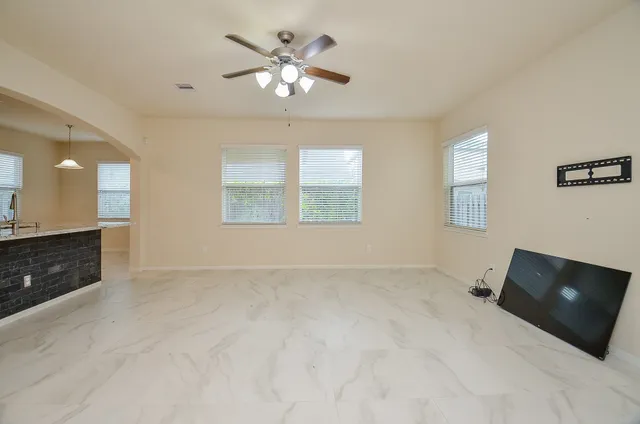 a view of an empty room with a window