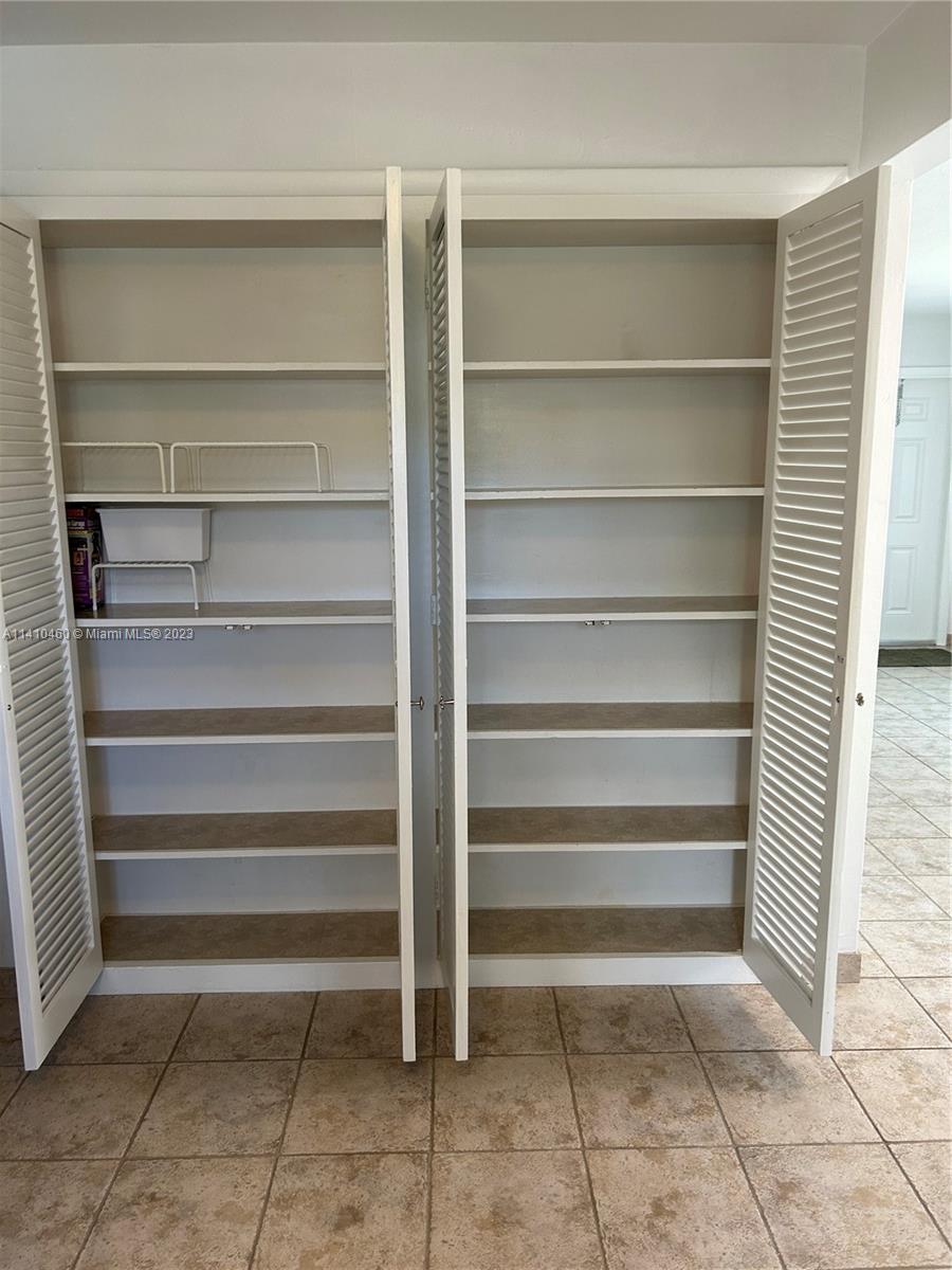 3790 Polk Street Hollywood, FL 33021 - Photo 23 of 23 a view of walk in closet with empty racks