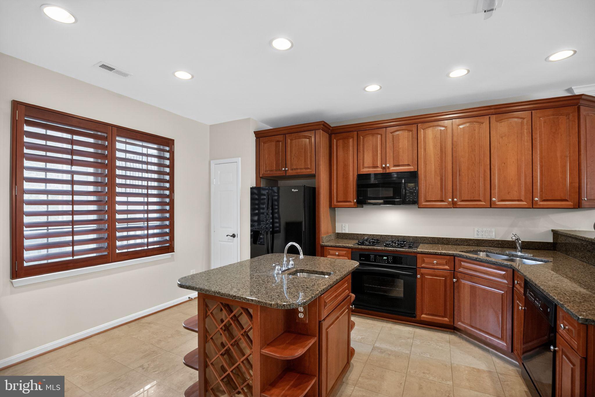 723 Runabout Loop, Unit 723 Solomons, MD 20688 - Photo 12 of 46 Island with wine rack