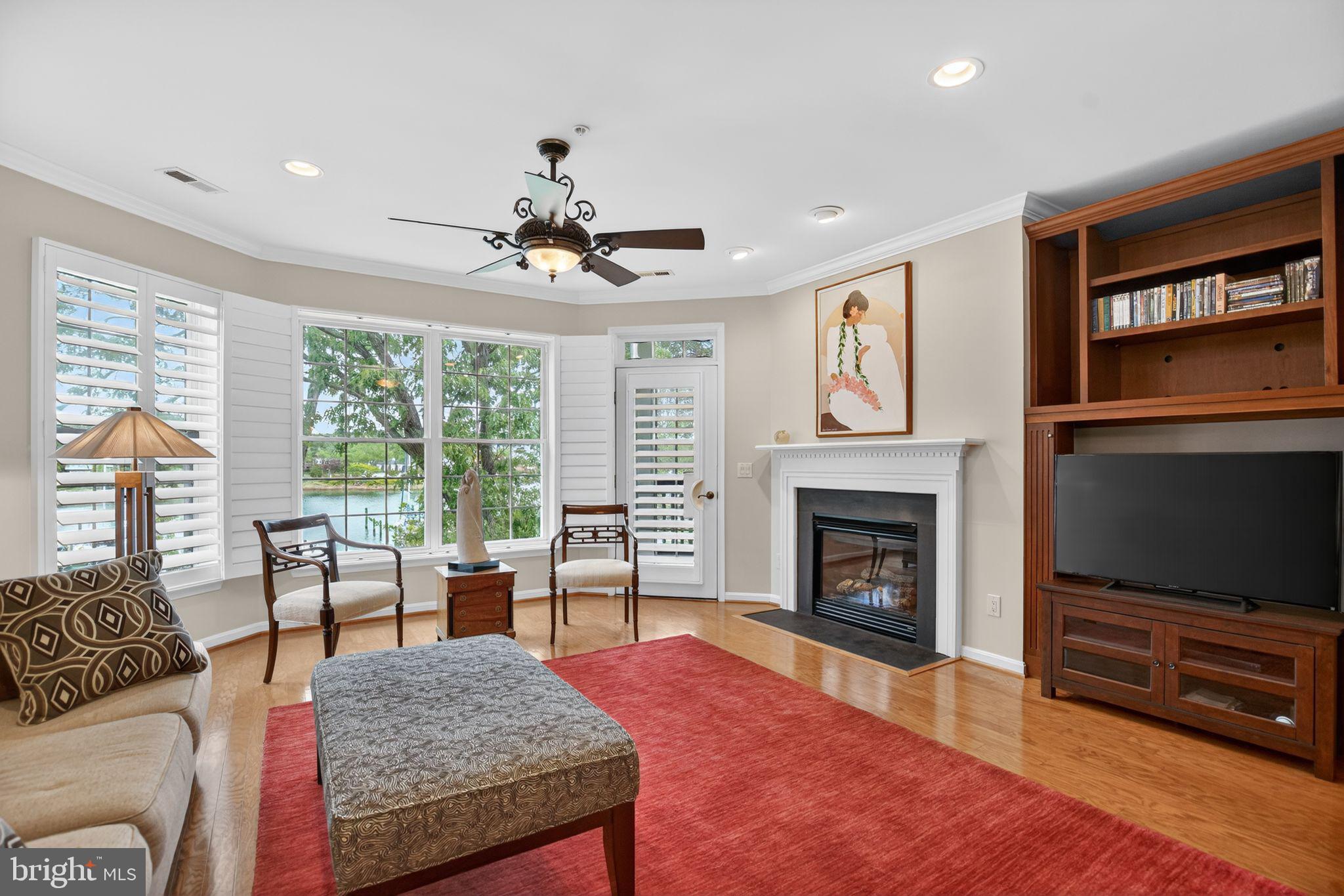 723 Runabout Loop, Unit 723 Solomons, MD 20688 - Photo 4 of 46 Living room with gas fieplace and built-in