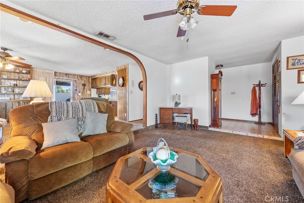 18200 Van Buren Boulevard Riverside, CA 92508 - Photo 12 of 56 a living room with furniture and a flat screen tv