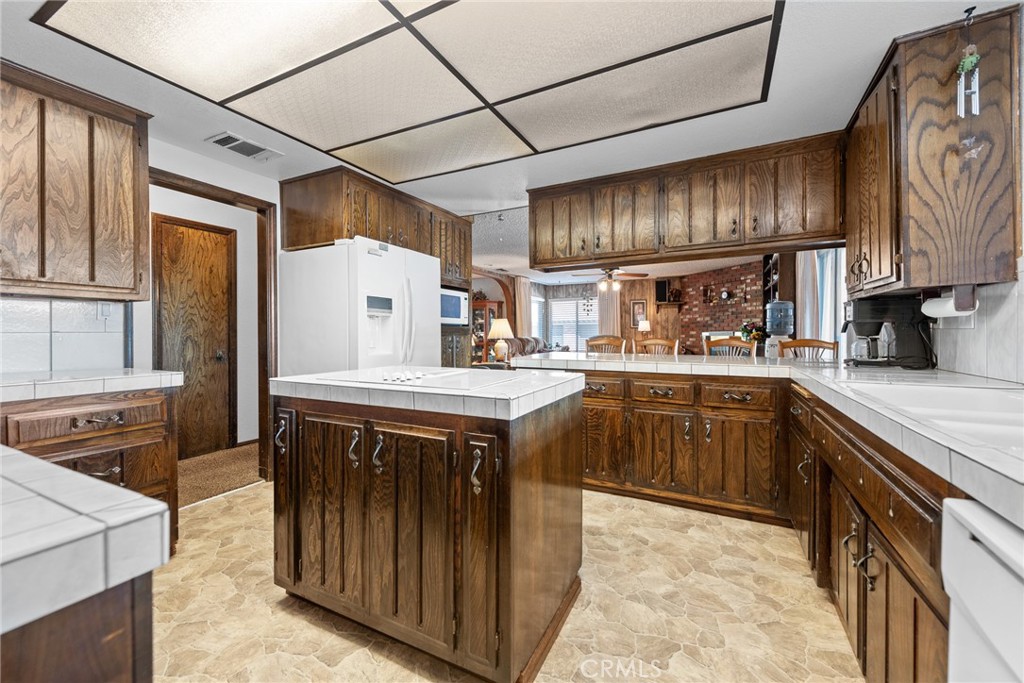18200 Van Buren Boulevard Riverside, CA 92508 - Photo 21 of 56 a kitchen with stainless steel appliances granite countertop a stove and a refrigerator