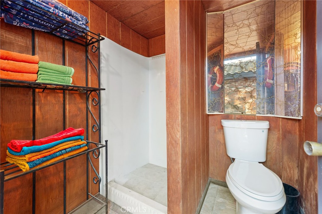 18200 Van Buren Boulevard Riverside, CA 92508 - Photo 38 of 56 a bathroom with a toilet and a shower curtain