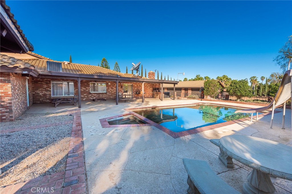 18200 Van Buren Boulevard Riverside, CA 92508 - Photo 40 of 56 a view of a swimming pool with an outdoor seating