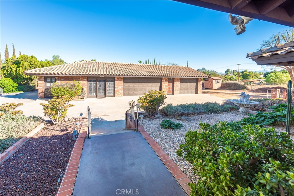 18200 Van Buren Boulevard Riverside, CA 92508 - Photo 43 of 56 a front view of a house with a yard