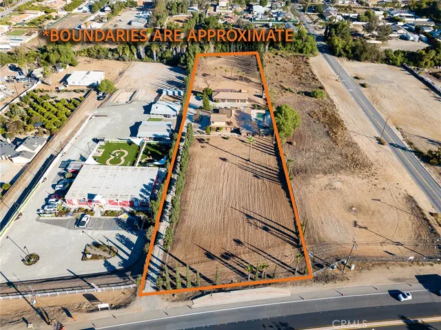 a spacious bedroom with a bed and a chandelier