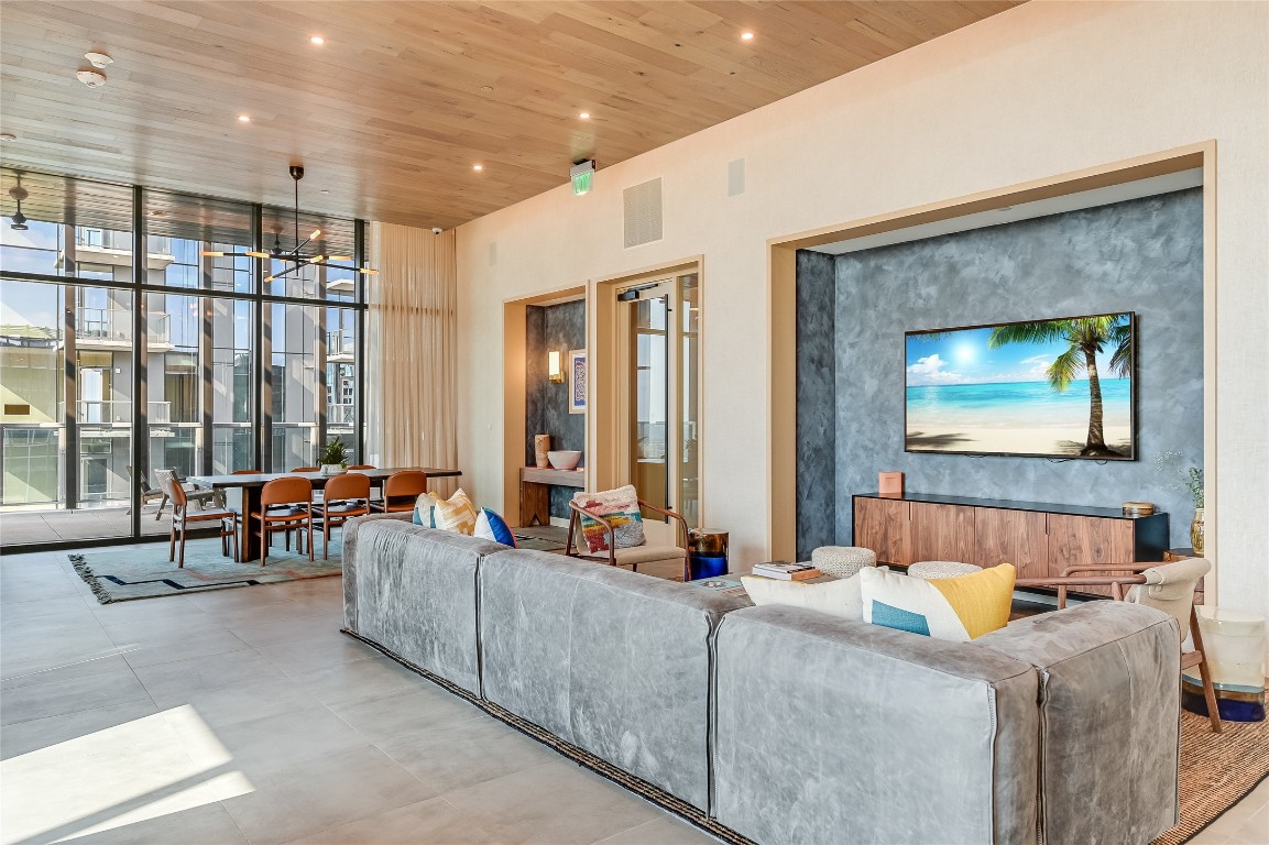 48 East Avenue, Unit 1701 Austin, TX 78701 - Photo 28 of 33 a living room with furniture and large windows
