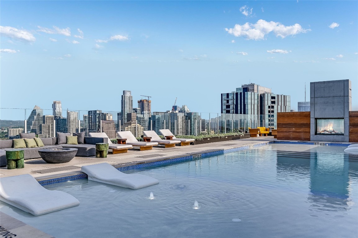 48 East Avenue, Unit 1701 Austin, TX 78701 - Photo 31 of 33 a view of a livingroom with furniture and a fireplace