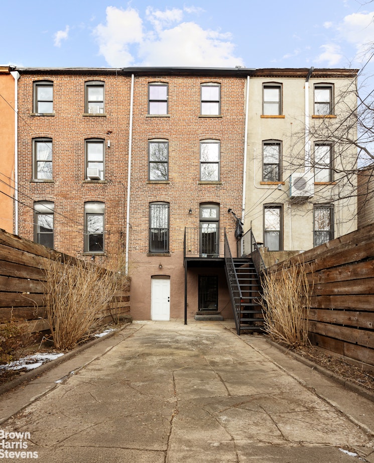 738 Madison Street Brooklyn, NY 11221 - Photo 12 of 14 a front view of a building with many windows