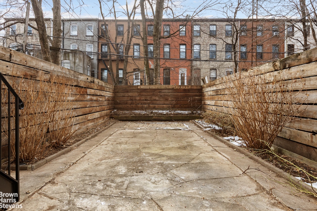 738 Madison Street Brooklyn, NY 11221 - Photo 13 of 14 a view of a brick buildings with many windows