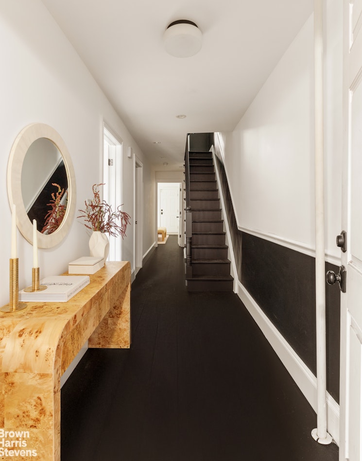 738 Madison Street Brooklyn, NY 11221 - Photo 7 of 14 a view of a living space with furniture and staircase