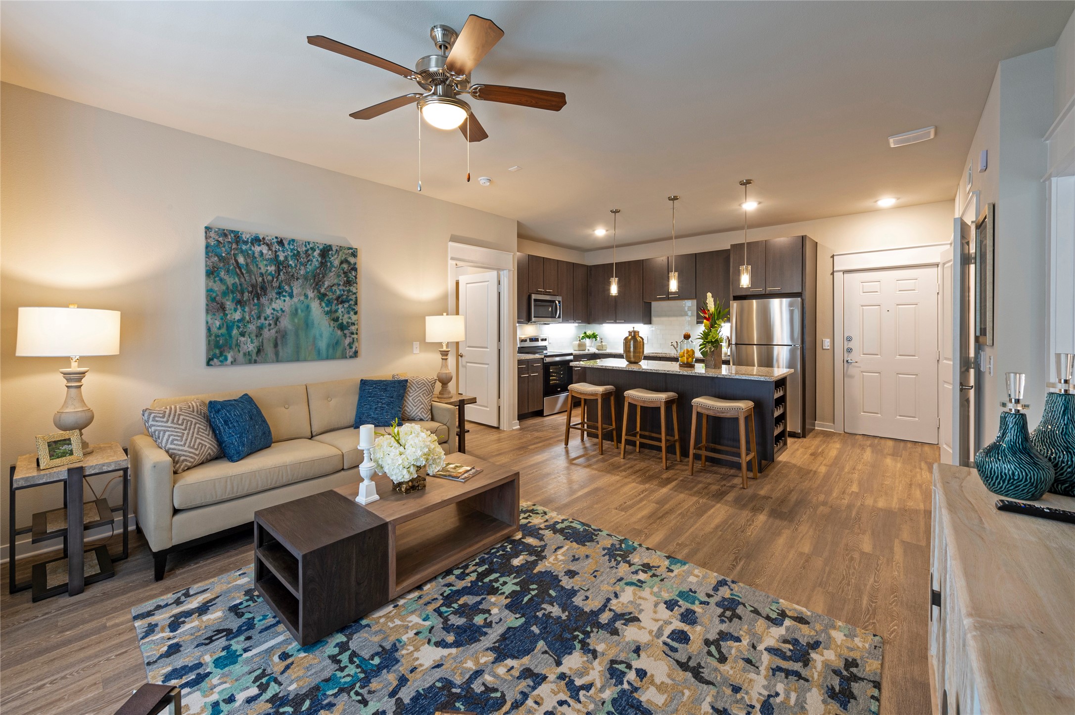1616 Partnership Way, Unit 2104 Katy, TX 77449 - Photo 13 of 22 a living room with furniture and wooden floor