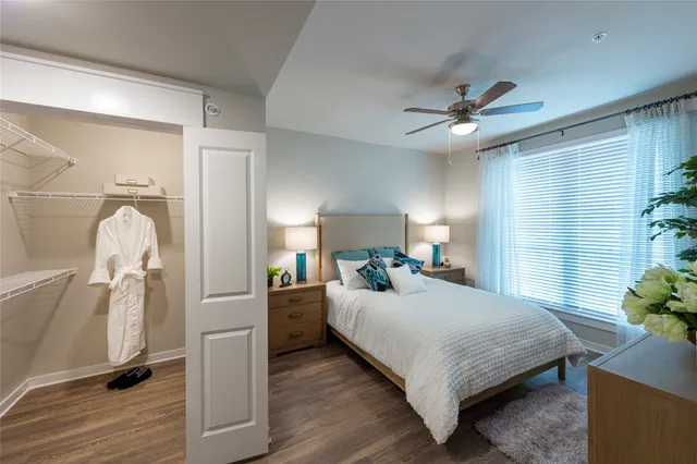 a kitchen with stainless steel appliances granite countertop a refrigerator a stove a sink and a microwave