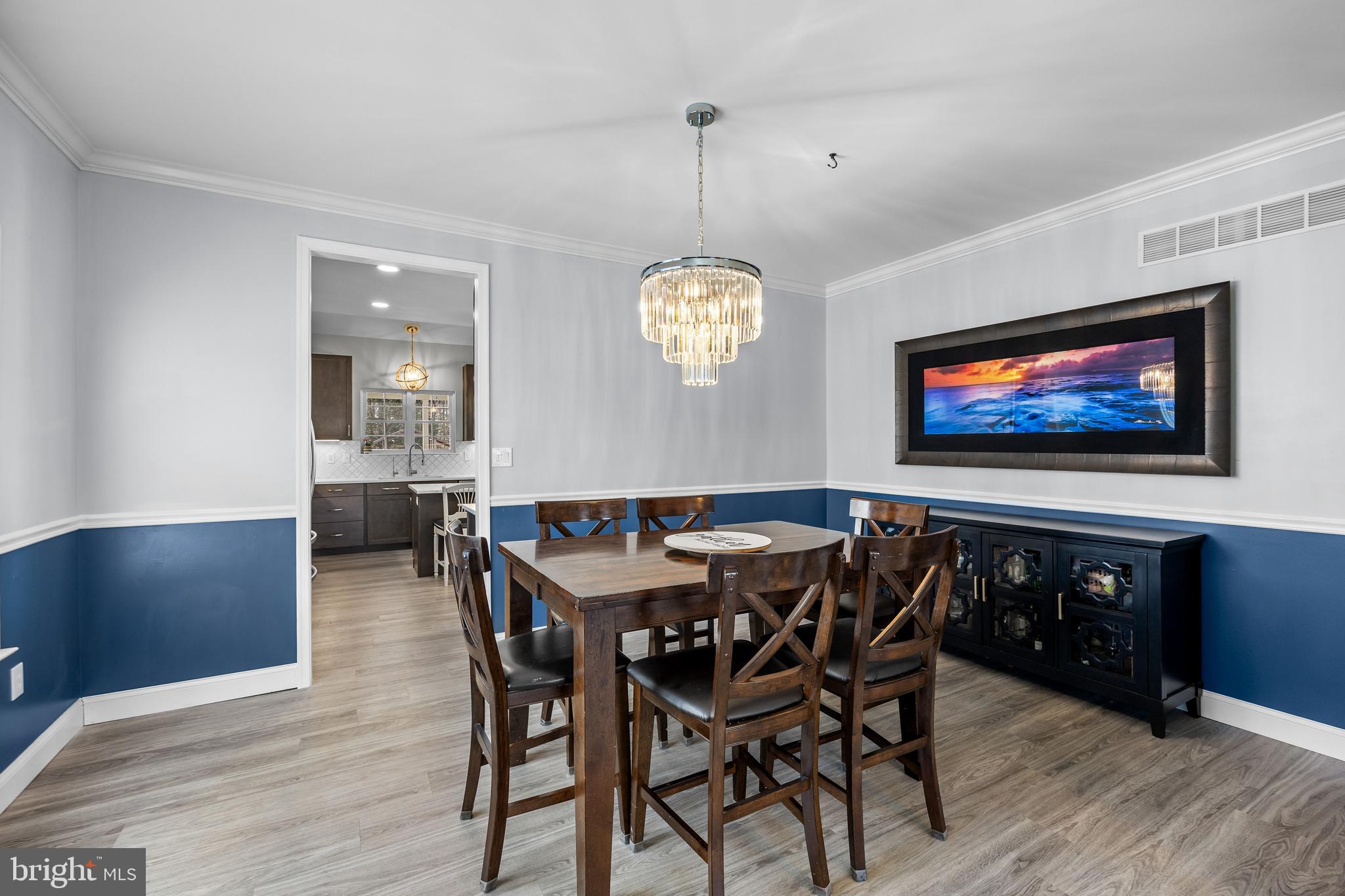 15 Millway Road Lumberton, NJ 08048 - Photo 17 of 66 a view of a dining room with furniture a chandelier and wooden floor