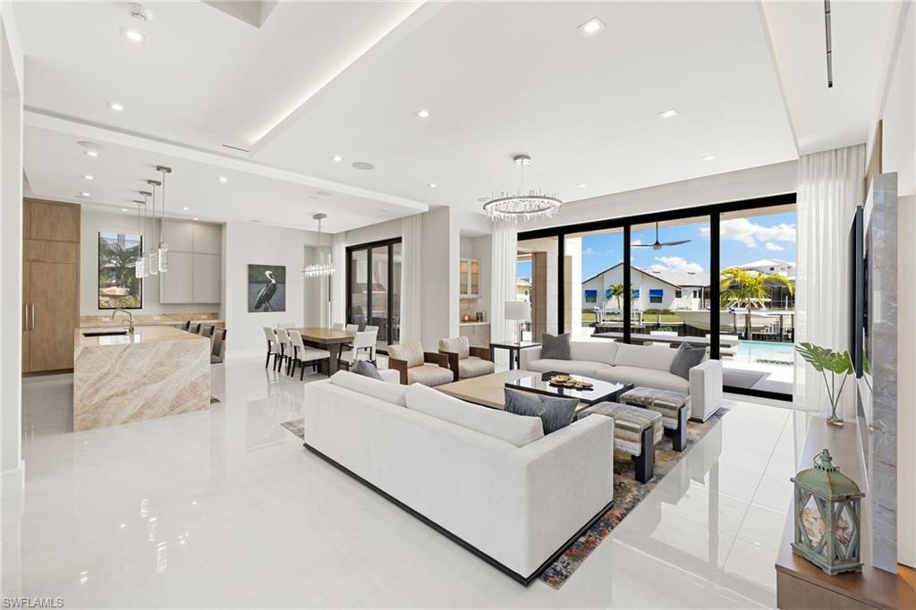 2345 Tarpon Road Naples, FL 34102 - Photo 5 of 43 Living room featuring suspended lighting