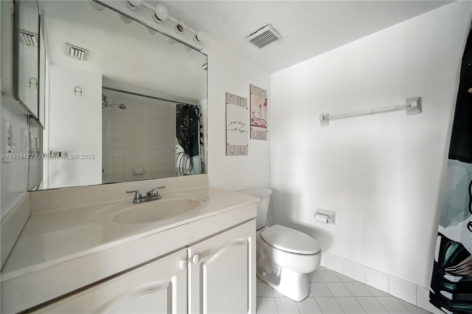 1270 Southeast 26th Street, Unit 101 Homestead, FL 33035 - Photo 13 of 18 a bathroom with a sink a toilet and shower