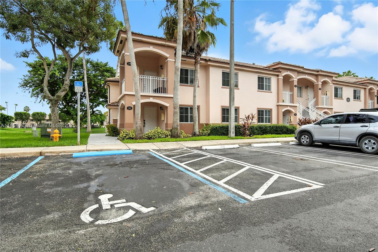 1270 Southeast 26th Street, Unit 101 Homestead, FL 33035 - Photo 17 of 18 a view of a white apartments with large windows