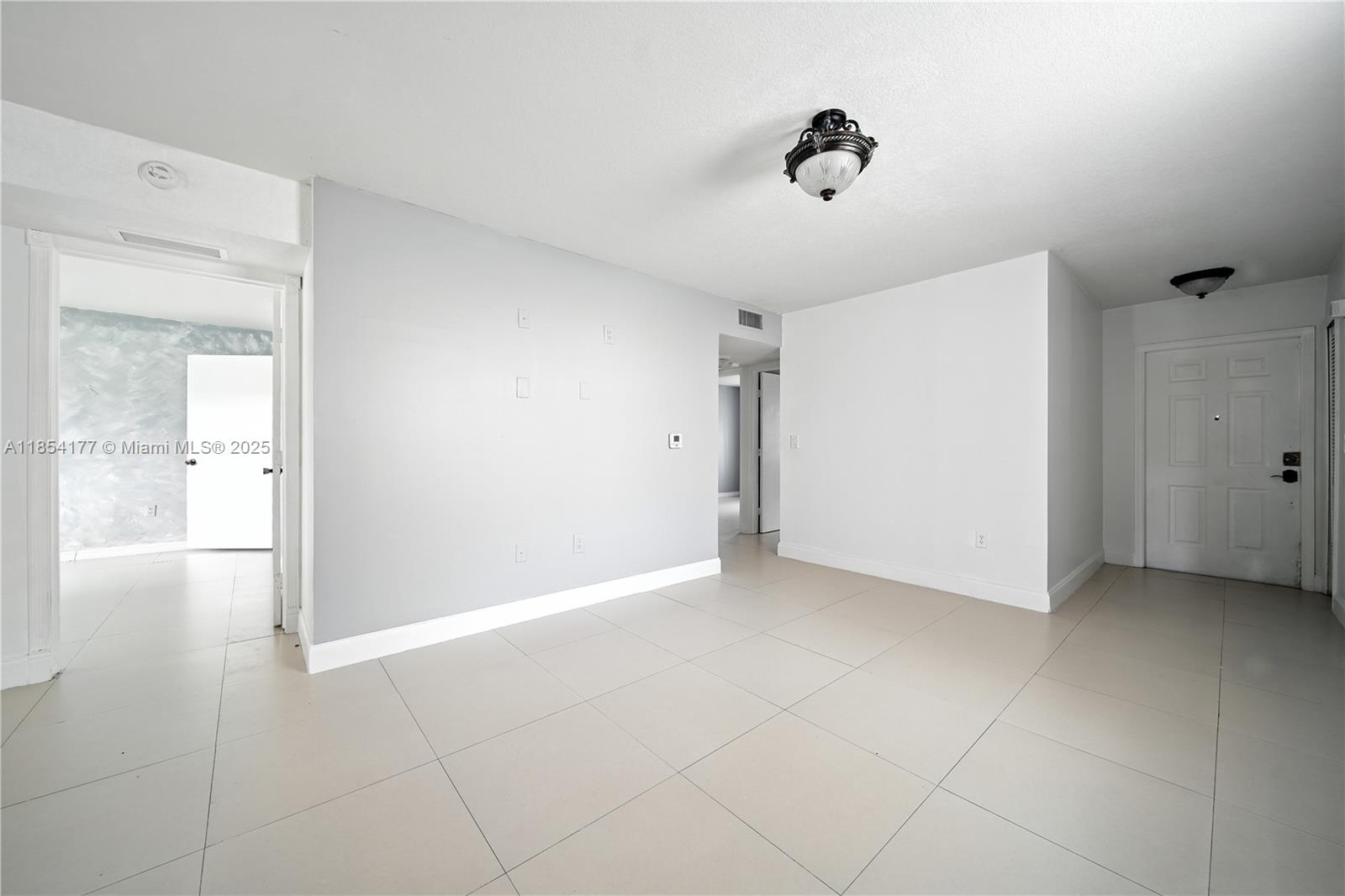 1270 Southeast 26th Street, Unit 101 Homestead, FL 33035 - Photo 3 of 18 a view of an empty room