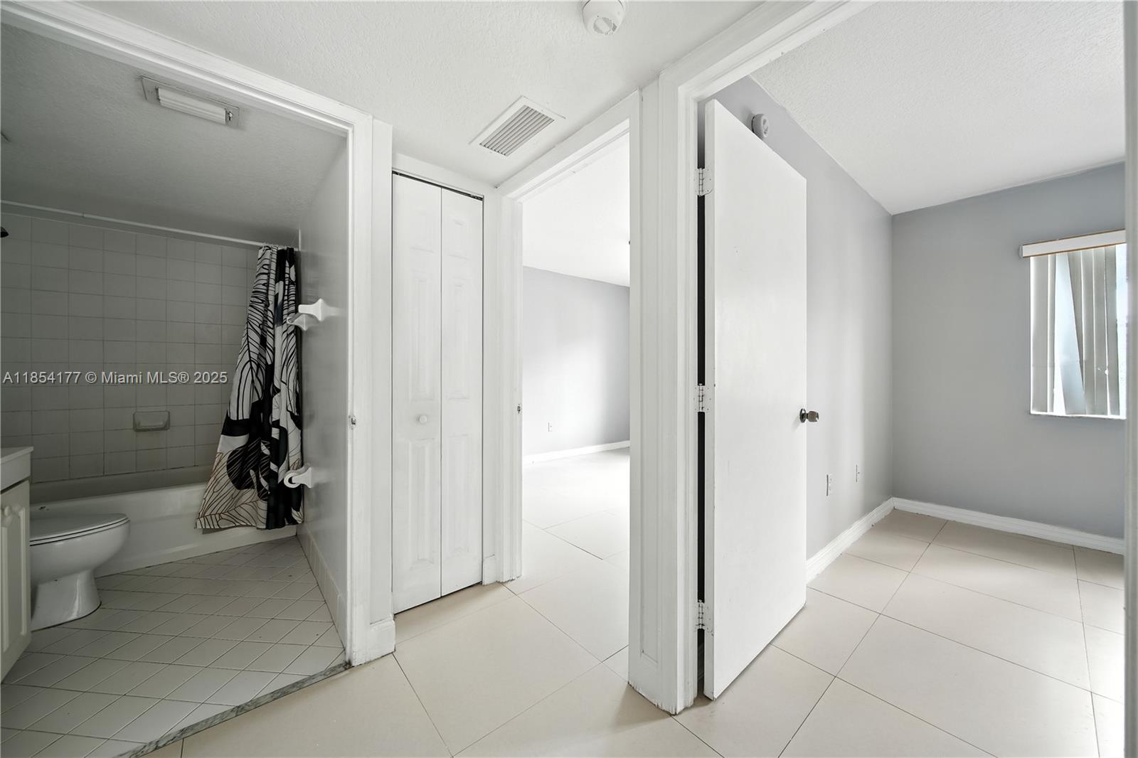 1270 Southeast 26th Street, Unit 101 Homestead, FL 33035 - Photo 9 of 18 a bathroom with a toilet and a shower