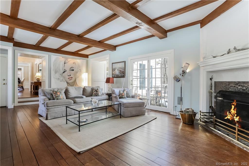 145 Cognewaugh Road Greenwich, CT 06807 - Photo 1 of 1 a living room with furniture and a fireplace