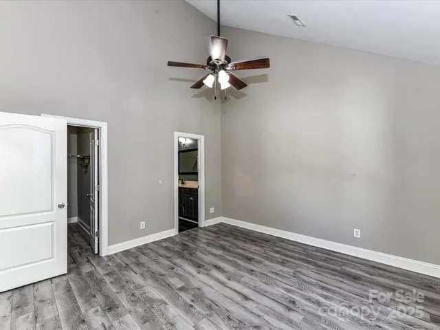 a view of a livingroom with a ceiling fan and a window