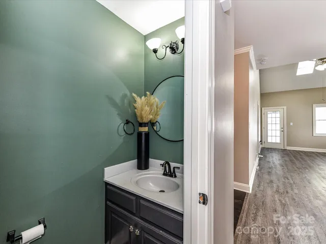 a bathroom with a sink and mirror