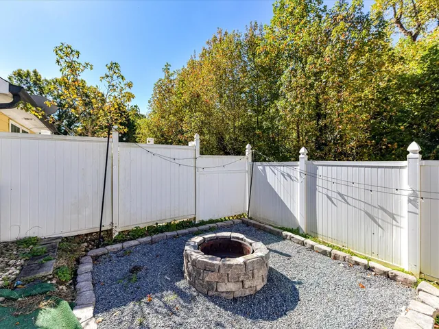 a wooden fence with a tree