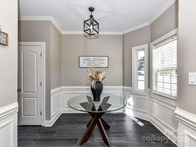 a view of a room with furniture window and wooden floor