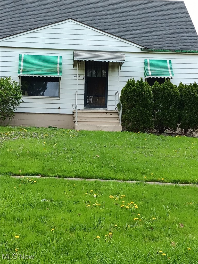 4407 Wyatt Road Cleveland, OH 44128 - Photo 2 of 25 Entrance to property with roof with shingles and a yard