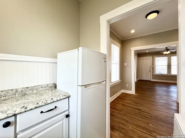 a white refrigerator freezer sitting inside of a kitchen